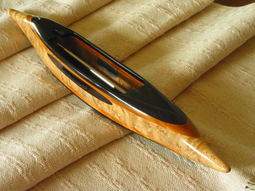 Exhibition ebony shuttle with buckthorn and bird's eye maple.  Shuttle sanded to 12,000 grit before finishing.