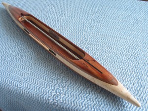 fq62016koawbemapl22: figured koa top/bottom, black walnut 2nd layers, bird’s eye maple center. Brazilian ebony yarn slot inserts. 3.0 oz., 15 1/4″L, 1 1/2″W, 11/16″H, 4” tip to nearest cavity end. Takes 6” quills