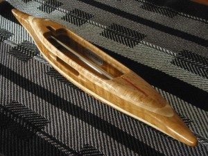 StdB4Shuttle37: Bird's eye maple (dark) top/bottom, hard tiger maple 2nd layers, curly white oak center. 4.8oz., 12 5/8"L, 1 3/4"W, 1 1/8"H, 4" cavity end to tip. Fits 4" bobbins