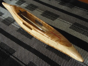 StdB4Shuttle43: Maple burl top/bottom, hard tiger maple 2nd layers, bird's eye maple (light) center. 4.5oz., 13 3/8"L, 1 3/4"W, 1 1/8"H, 4 3/8" cavity end to tip. Fits 4" bobbins.